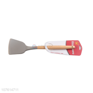 Good quality heat resistant non-stick silicone turner with wooden handle