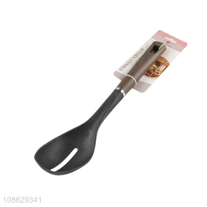 Good quality non-stick slotted basting spoon with wood grain handle