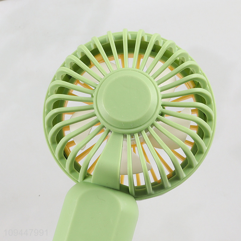 Low price cartoon handheld mini electric fan for sale